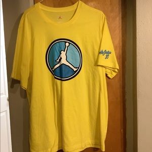 a yellow and blue jordan shirt
